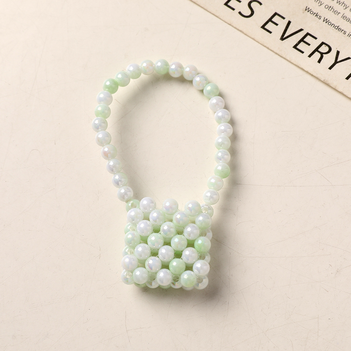 Elegantly designed faux pearl woven mini handbag/shoulder bag/crossbody bag with pearl accessories.