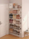 The bag storage artifact behind the door is built against the wall and floor-to-ground multi-layer ultra-thin joint display rack for bag storage rack