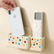 Air conditioning TV remote control wall-mounted storage box without punching on the bedside wall mobile phone charging and placement rack base bracket