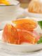 Kumquat-Kuchen, altmodische orangefarbene Kuchen, orangefarbene orangefarbene Kuchen, Kumquat-kandierte Früchte, getrocknete Kumquat-Früchte, nostalgische Snacks, in Wasser getränkt