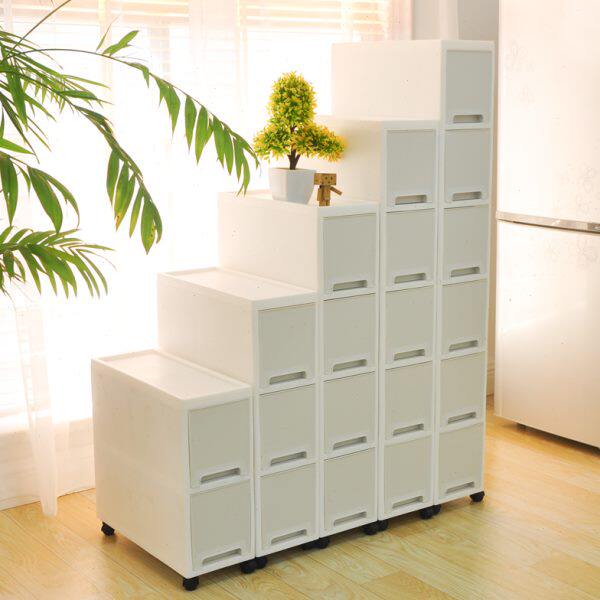 Slit-slit storage cabinet next to kitchen refrigerator and movable storage cabinet in bathroom