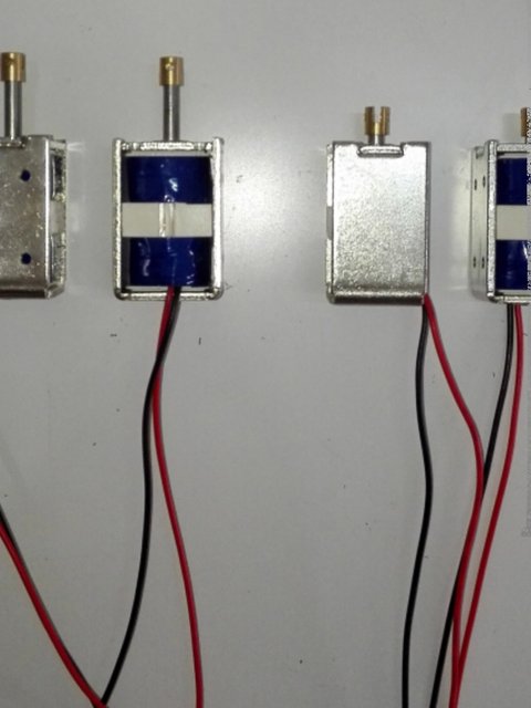 Bidirectional self-held electromagnet pulse push-pull electromagnet stroke 12MM inertia 2-head out shaft