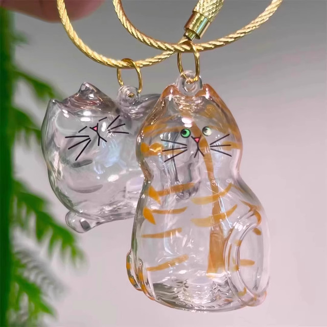 Transparent cat-shaped cat hair storage pendant gag cat hair storage capsules commemorative bag keychain bag pendant