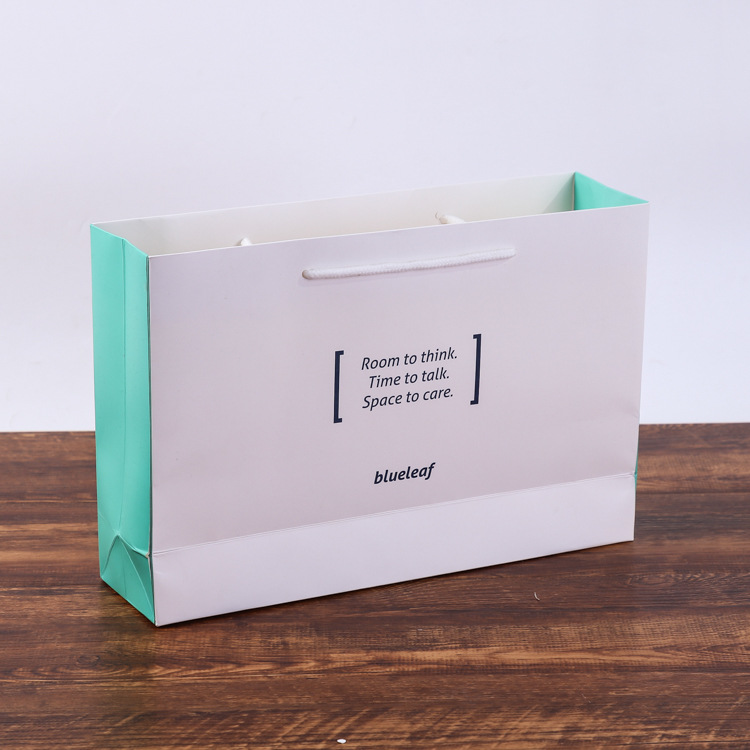 厂家供应 纸袋定制 简约服装手提袋定做 白卡纸广告购物袋定做