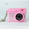 Small camera, necklace, keychain, purse, phone case, accessory, pendant, makes sounds