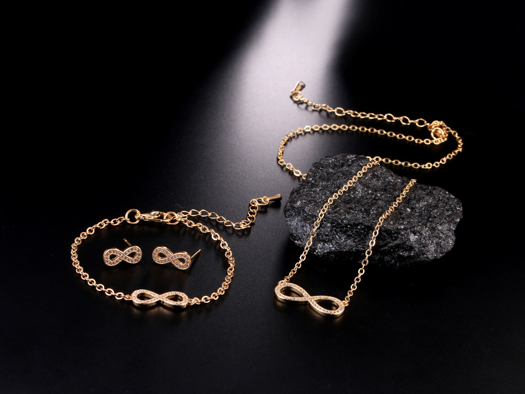 Joyería transfronteriza europea y americana exquisita pequeña circón de cobre invertido 8-palabra pendientes infinitos collar pulsera Comercio exterior conjunto de tres piezas