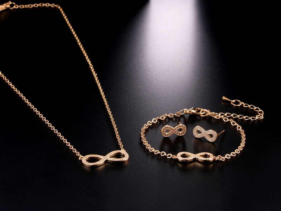 Joyería transfronteriza europea y americana exquisita pequeña circón de cobre invertido 8-palabra pendientes infinitos collar pulsera Comercio exterior conjunto de tres piezas