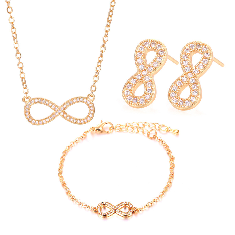 Joyería transfronteriza europea y americana exquisita pequeña circón de cobre invertido 8-palabra pendientes infinitos collar pulsera Comercio exterior conjunto de tres piezas
