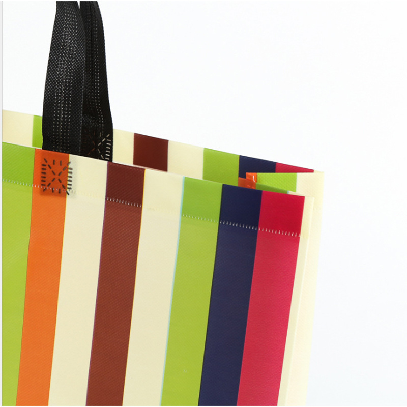 En stock bolso no tejido personalizado Impresión logotipo ropa publicidad bolsa color película no tejida