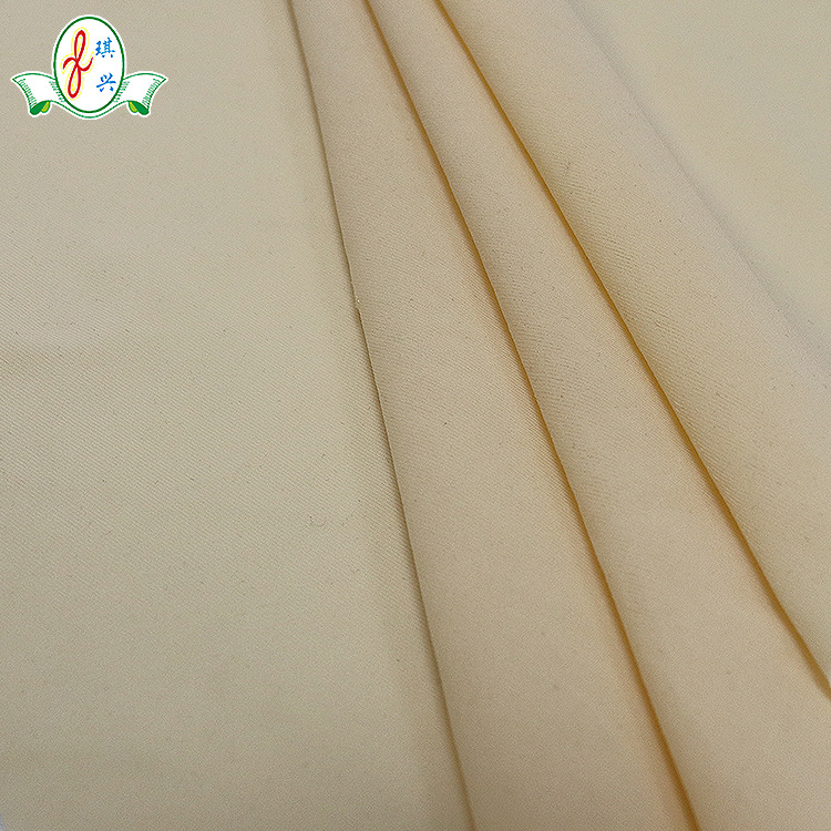 广东厂家直供28%氨纶72%尼龙140g肤色内衣高弹力锦纶针织面料泳衣