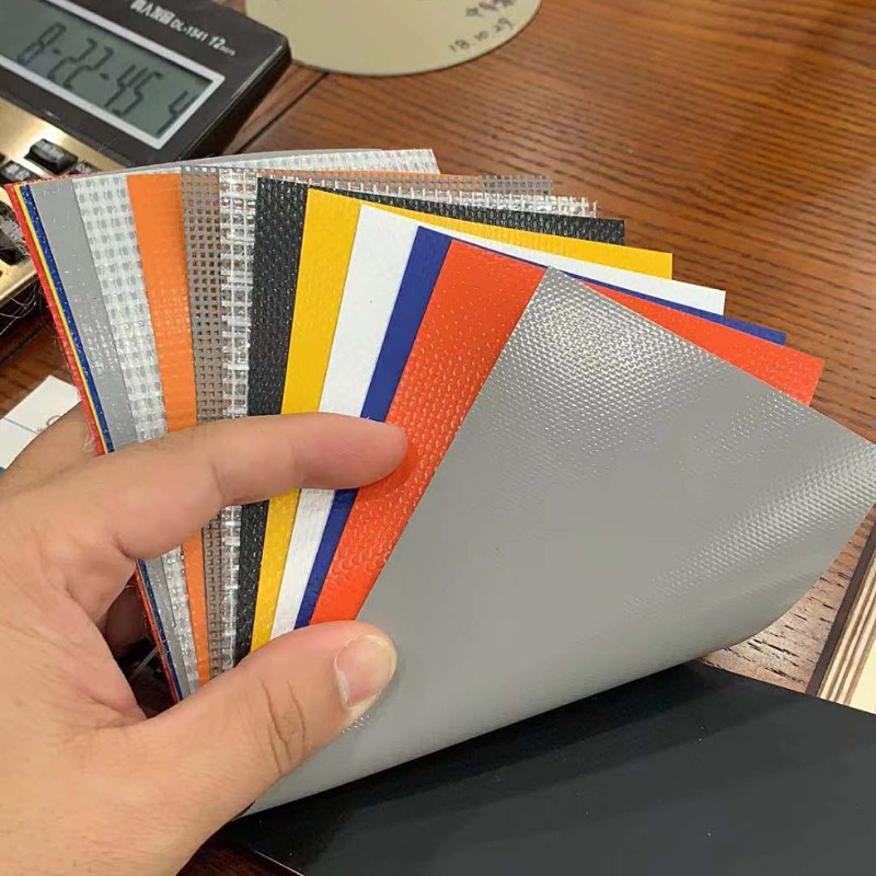 现货销售防晒阻燃1300克涂层布高强夹网布橙色黑色软门帘堆积门布