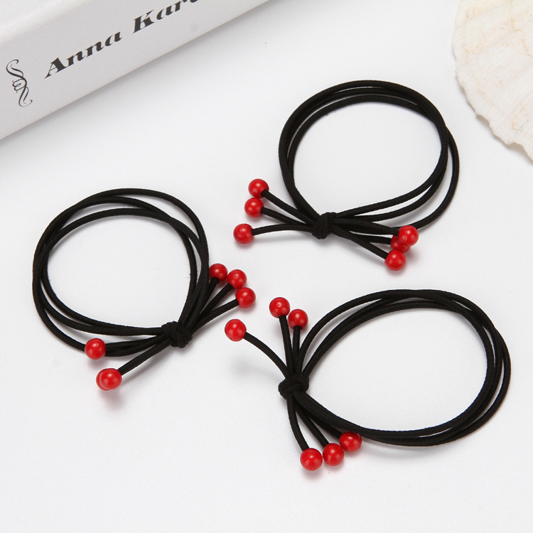 Coreana de cereza pequeña perla roja 3 en 1 de alta elasticidad frijoles rojos cuerda de cabeza de cuerda de cabello de mariposa correa de correa de mujer al por mayor