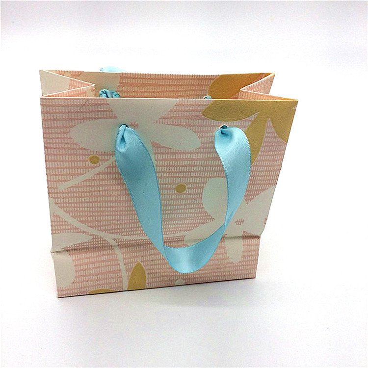 直销服装手提袋纸袋印刷logo 茶叶眼镜购物包装袋广告通用礼品袋
