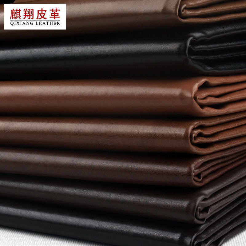 义乌厂家AR132纹pu皮革面料0.7厚TC布底皮带革箱包软包人造革皮料