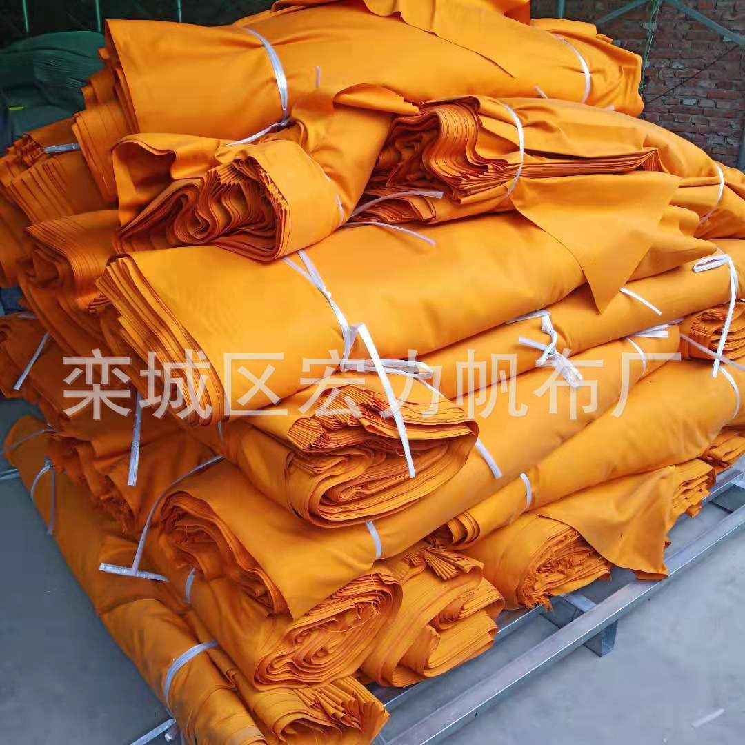 Poliéster amarillo brillante impermeable teñido lienzo naranja mongol bolsa impermeable tela amarilla rollo completo tela al por mayor
