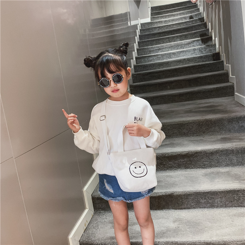 Bolso bandolera para niños 2021 Nuevo bolso de cubo Mini de lona de estilo coreano linda cara sonriente bolso de niña impreso de doble cara