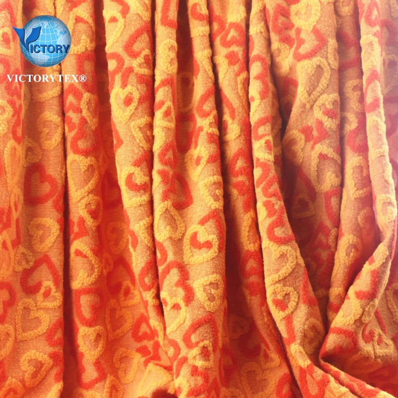 时尚女装夹克面料针织纬编摇粒绒阳离子心型大提花单刷单摇粒绒布