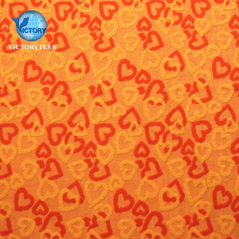 时尚女装夹克面料针织纬编摇粒绒阳离子心型大提花单刷单摇粒绒布