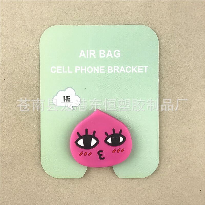 En stock al por mayor TikTok Cartoon creativo soporte de teléfono móvil puede soportar airbag soporte de teléfono móvil soporte de escritorio