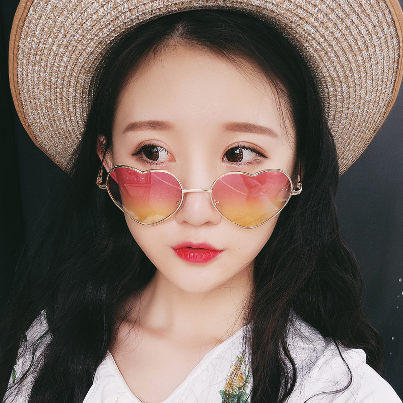 Retro fashionable sunglasses heart-shaped