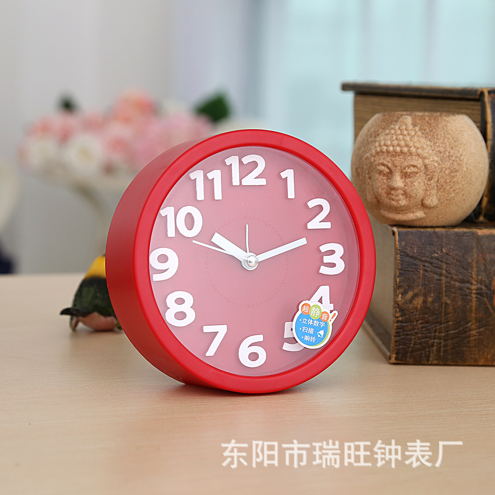 Directa de fábrica redonda tridimensional pequeño reloj de alarma estudiante reloj creativo moda simple reloj de alarma dormitorio decoración reloj
