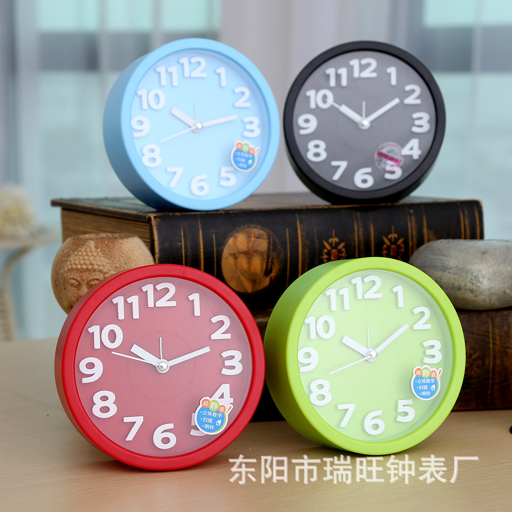 Directa de fábrica redonda tridimensional pequeño reloj de alarma estudiante reloj creativo moda simple reloj de alarma dormitorio decoración reloj