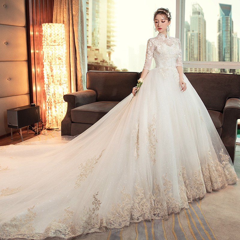Vestido de novia estilo Hepburn 2026 con cuello alto, cola larga vintage, estilo princesa, largo hasta el suelo y manga larga.