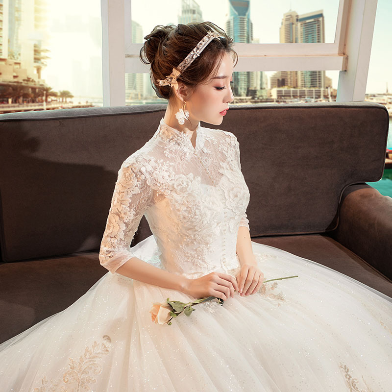 Vestido de novia estilo Hepburn 2026 con cuello alto, cola larga vintage, estilo princesa, largo hasta el suelo y manga larga.