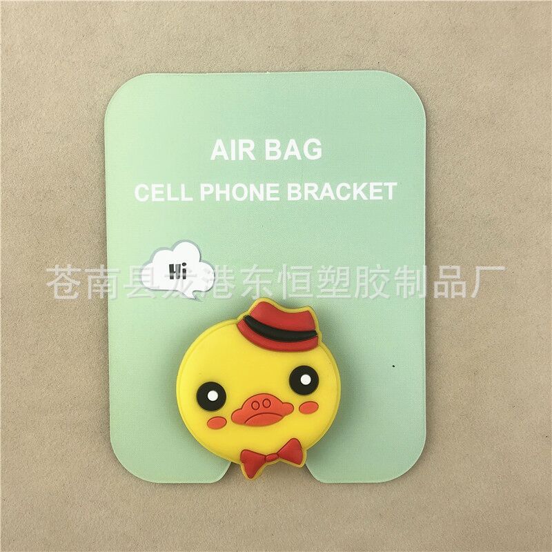 En stock al por mayor TikTok Cartoon creativo soporte de teléfono móvil puede soportar airbag soporte de teléfono móvil soporte de escritorio