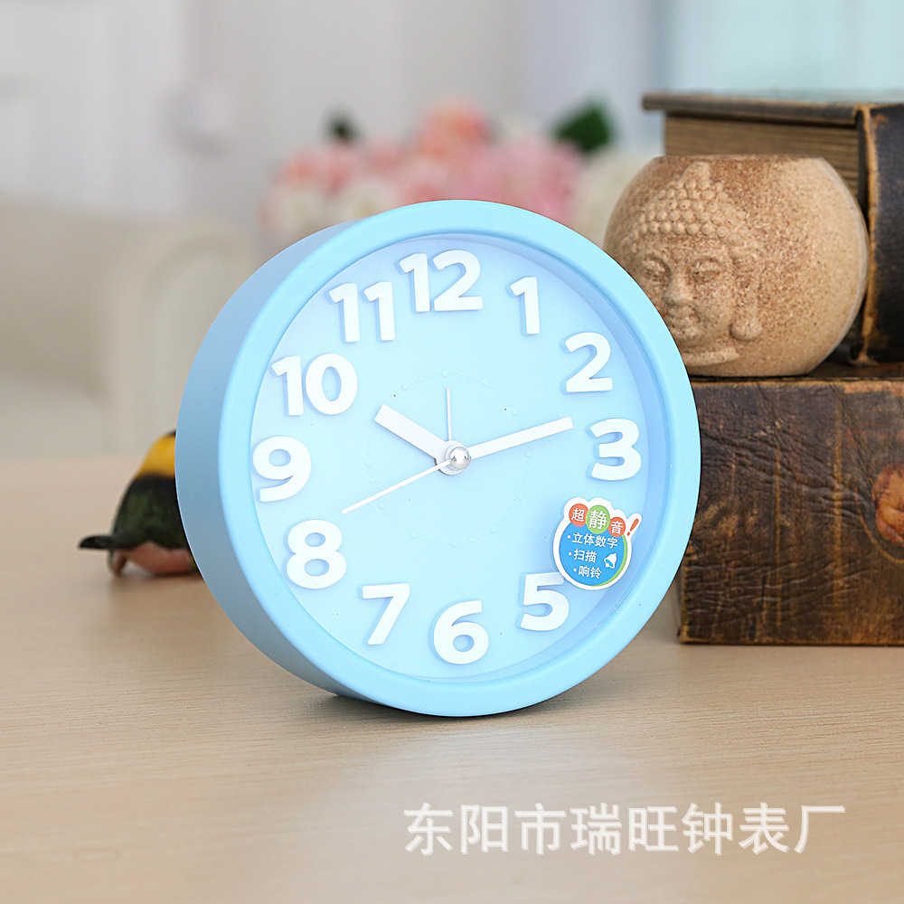 Directa de fábrica redonda tridimensional pequeño reloj de alarma estudiante reloj creativo moda simple reloj de alarma dormitorio decoración reloj