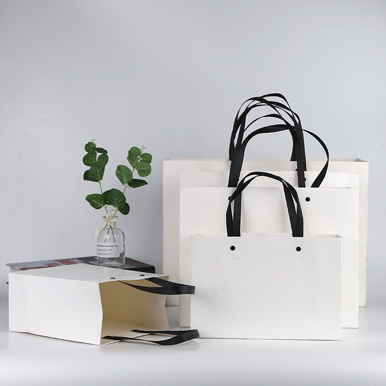 厂家定制白卡纸服装手提袋定制化妆品手提袋订做烫金广告饰品纸袋