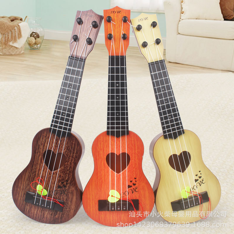 Instrumento musical de los niños simulación ukulele cuatro cuerdas puede jugar educación temprana música guitarra de juguete guitarra directa de fábrica
