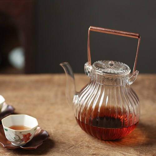 Chrysanthemum petal pattern heat-resistant glass teapot electric ceramic stove teapot teapot copper handle handle teapot flower teapot Kung Fu teapot