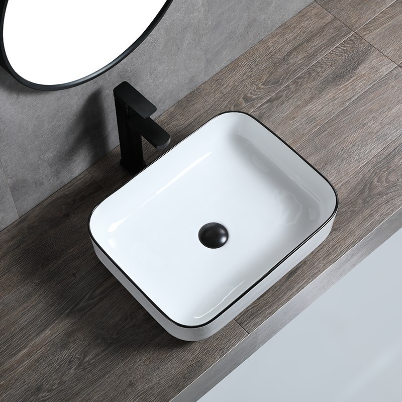 Borde negro lavabo de mesa de cerámica personalizado simple hotel nuevo lavabo de arte de cerámica lavabo lateral ultrafino lavabo de mesa al por mayor