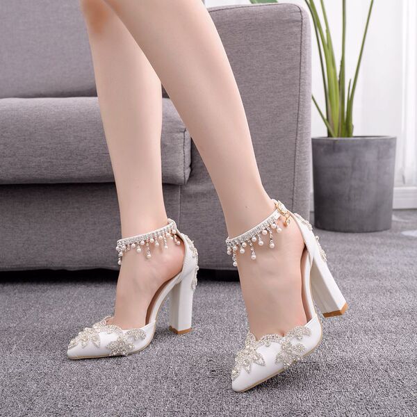 White wedding shoes pointed-toe with extremely high heels for bride