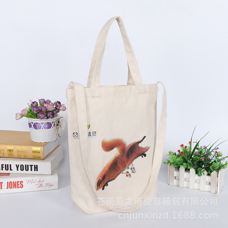 Comercio al por mayor y al por mayor vertical de gran capacidad Portátil Bolsa de lona estudiante hombro crossbody bolsa de algodón de almacenamiento de compras logotipo impreso