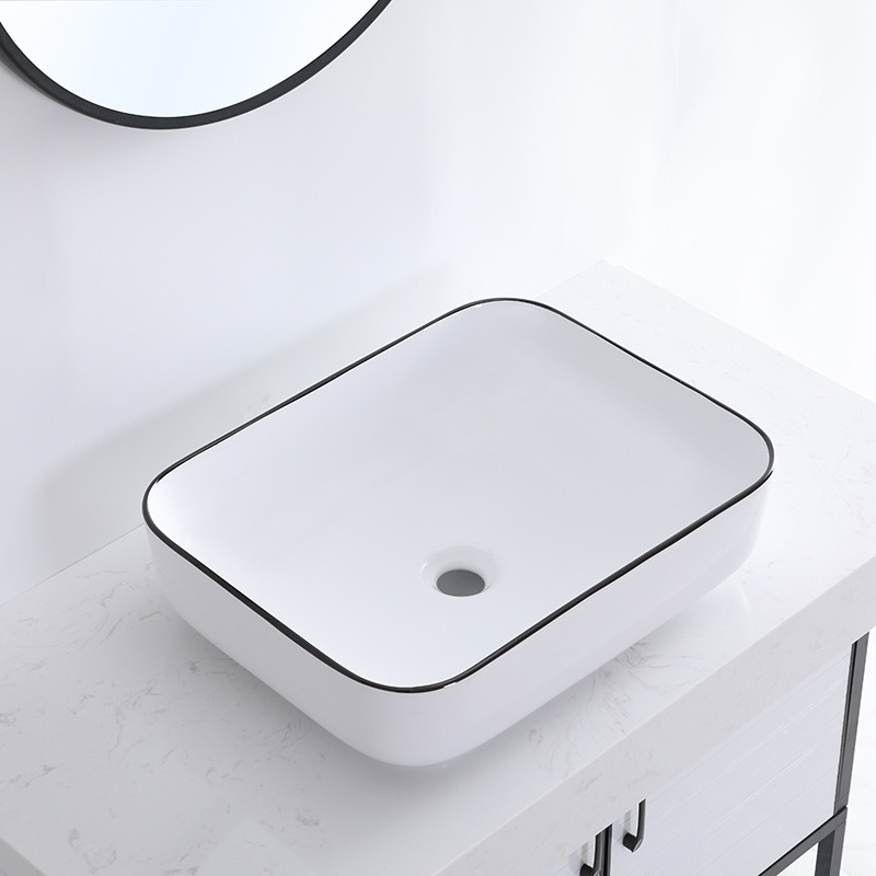 Borde negro lavabo de mesa de cerámica personalizado simple hotel nuevo lavabo de arte de cerámica lavabo lateral ultrafino lavabo de mesa al por mayor