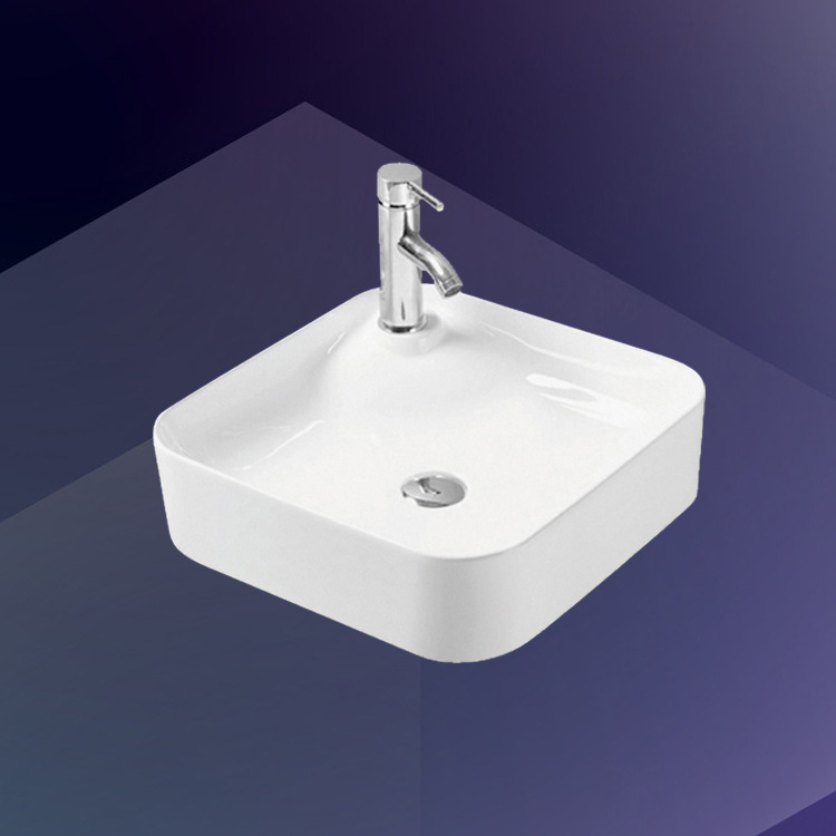 Lavabo cuadrado artístico de cerámica para encimera, para uso hotelero, fabricante de productos de lujo ligero.