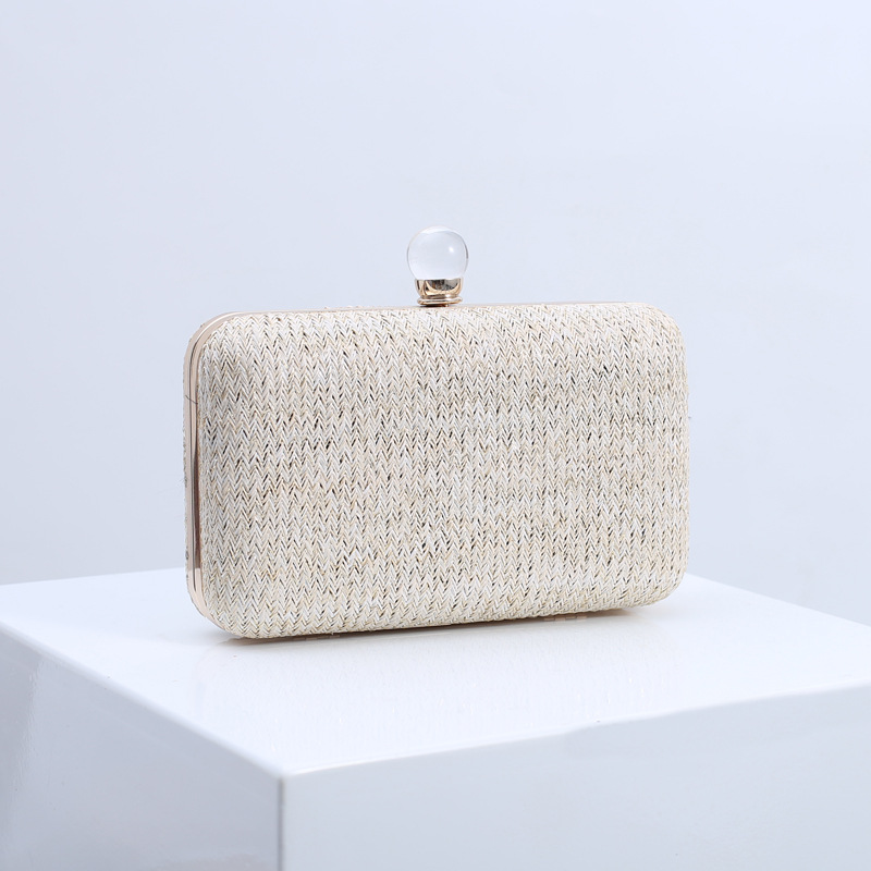 Bolso de mano creativo de verano tejido con paja para mujer, moda europea y americana, bolso de noche versátil multicolor, bolso de mujer transfronterizo con patrón de ondas de agua.