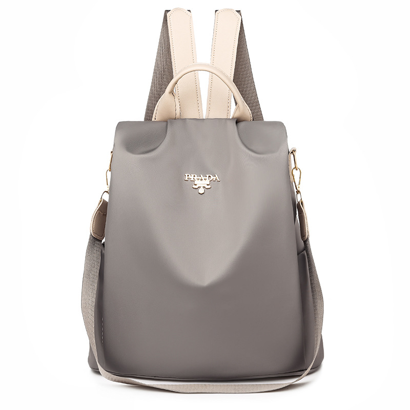 2025 nueva mochila para mujeres simple versátil mochila antirrobo de tela Oxford de gran capacidad mochila de color sólido transfronterizo para mujeres