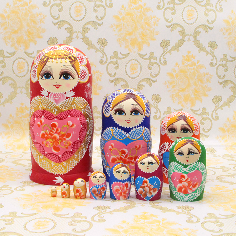 Russian nesting dolls, pink heart-shaped, wooden toy/craft item, 5-10 layers, random colors and patterns. (TikTok)