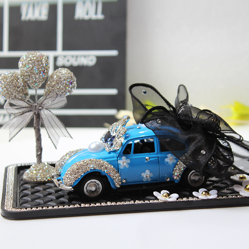 Modelo de coche, modelo de coche de arco creativo y colorido, adornos de diamantes, accesorios de interior de coche, decoración de tapete antideslizante de margarita pequeña