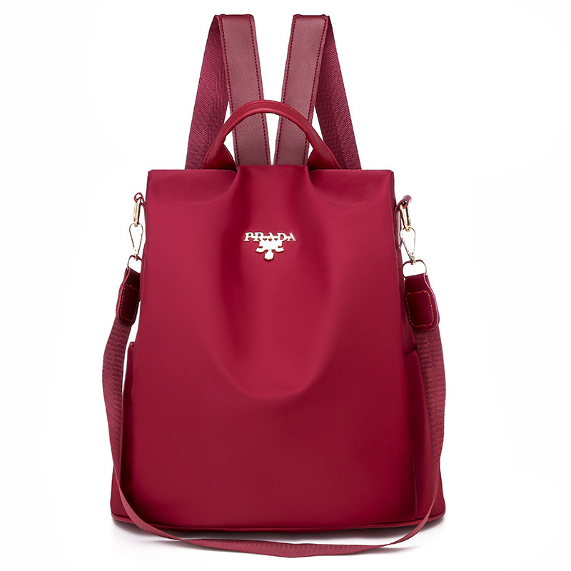 2025 nueva mochila para mujeres simple versátil mochila antirrobo de tela Oxford de gran capacidad mochila de color sólido transfronterizo para mujeres