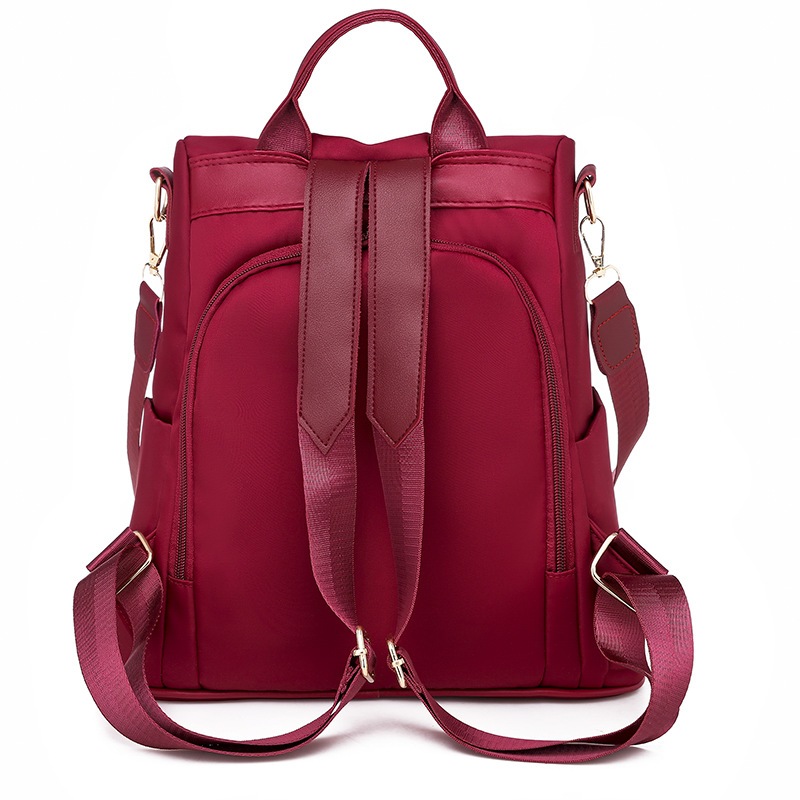 2025 nueva mochila para mujeres simple versátil mochila antirrobo de tela Oxford de gran capacidad mochila de color sólido transfronterizo para mujeres