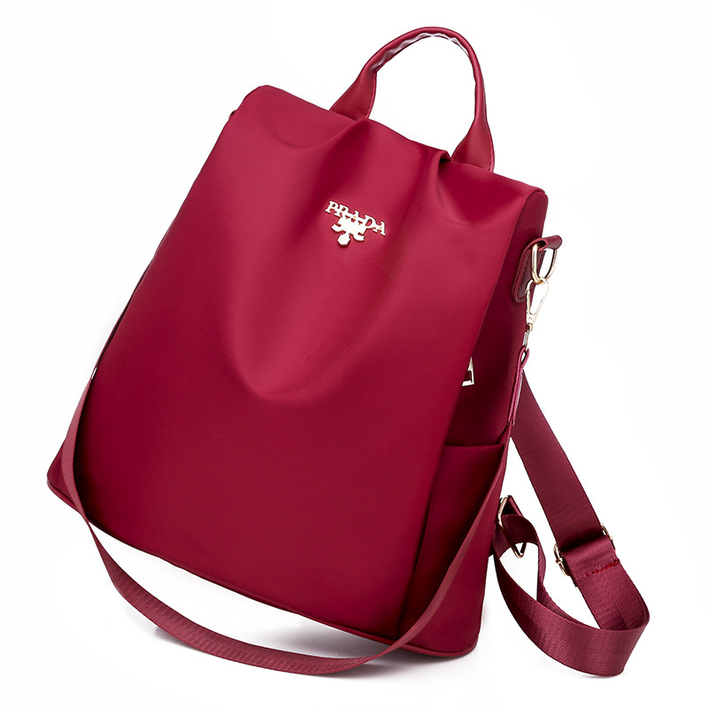 2025 nueva mochila para mujeres simple versátil mochila antirrobo de tela Oxford de gran capacidad mochila de color sólido transfronterizo para mujeres