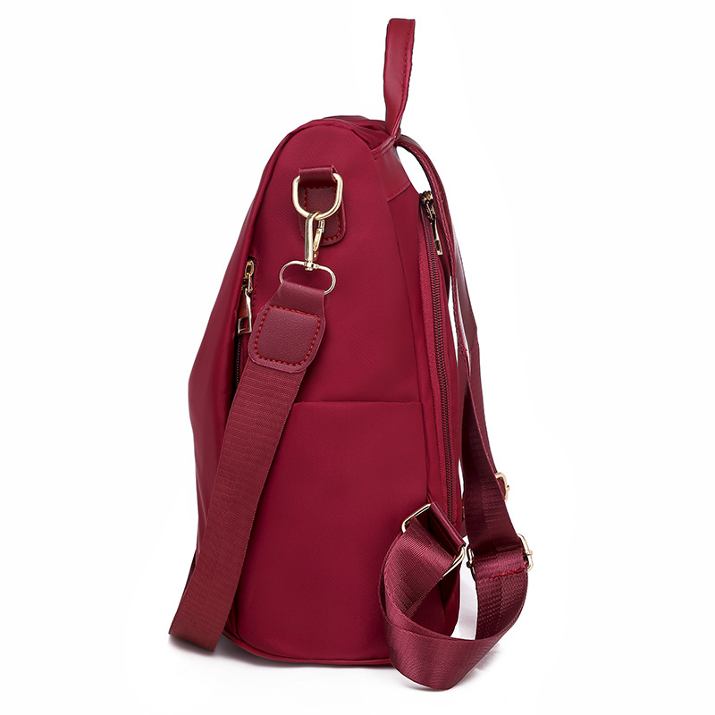 2025 nueva mochila para mujeres simple versátil mochila antirrobo de tela Oxford de gran capacidad mochila de color sólido transfronterizo para mujeres