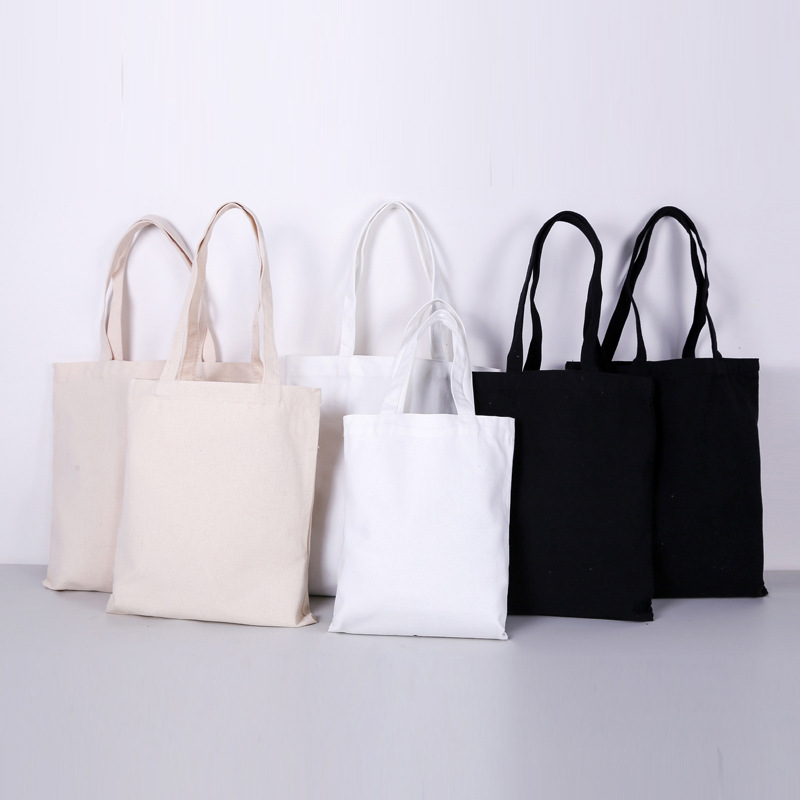 Bolsa de compras de lona en blanco en stock bolsa de lona portátil de impresión en color bolsa de lona negra publicitaria con logotipo