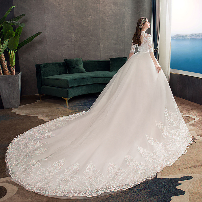 Vestido de novia principal al por mayor 2025, nuevo estilo, vestido de novia con cola larga, estilo bosque, entallado, cuello alto, manga media TD39.