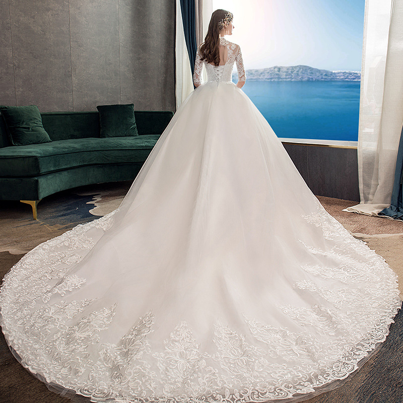 Vestido de novia principal al por mayor 2025, nuevo estilo, vestido de novia con cola larga, estilo bosque, entallado, cuello alto, manga media TD39.