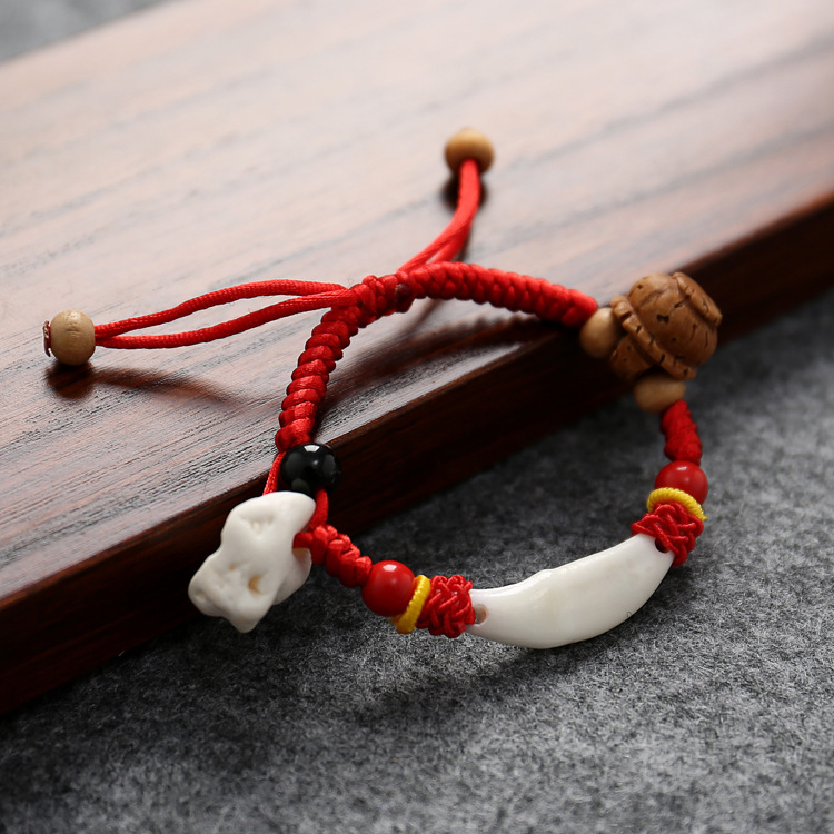 Infant anti-shock black dog tooth pig bone-shaking peach core basket red rope bracelet home outing red hand rope